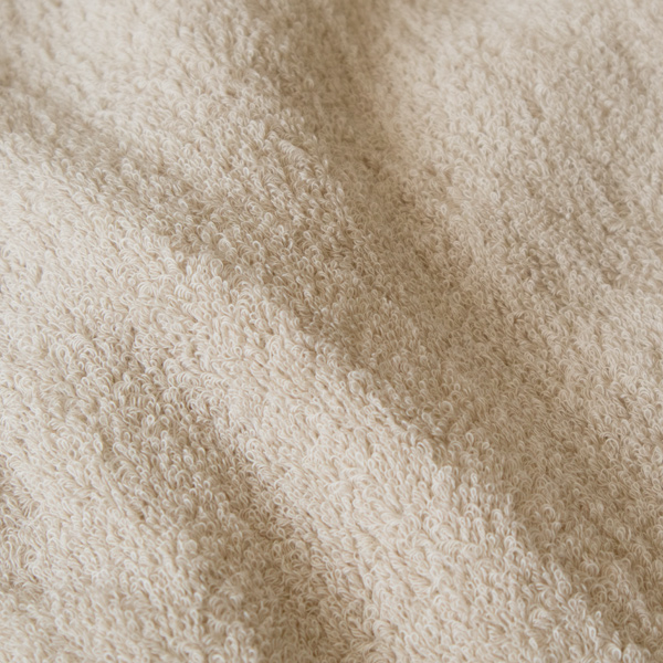 裏生地は吸収性に優れ、クッション性のあるループ糸が特徴のパイル(ベージュ) 裏生地は吸収性に優れ、クッション性のあるループ糸が特徴のパイル(ベージュ)