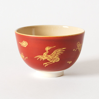Red-wrapped gold and lacquered matcha bowl